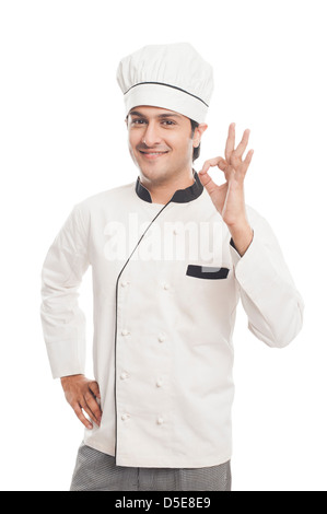 Portrait d'un homme chef showing ok sign and smiling Banque D'Images