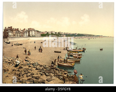 Cette image capture une scène de la plage à Exmouth, East Devon, Angleterre. Exmouth est une station balnéaire populaire connue pour sa beauté côtière et ses possibilités de loisirs. Banque D'Images