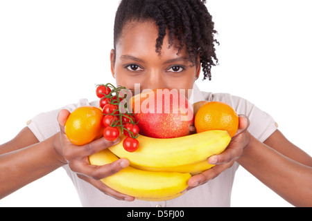 Les jeunes professionnels noir / african american woman holding fruits frais isolé sur fond blanc Banque D'Images