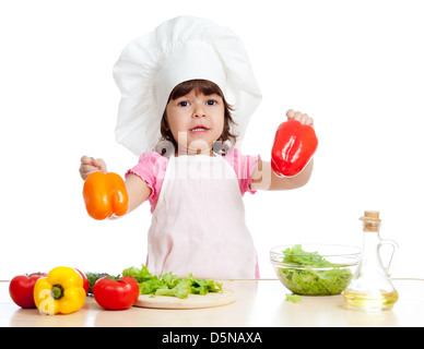 Scullion little girl holding vegetables Banque D'Images