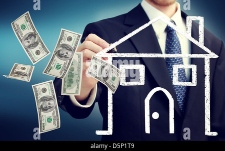 L'homme d'affaires d'une maison dessin illustration et battant cent dollar bills Banque D'Images