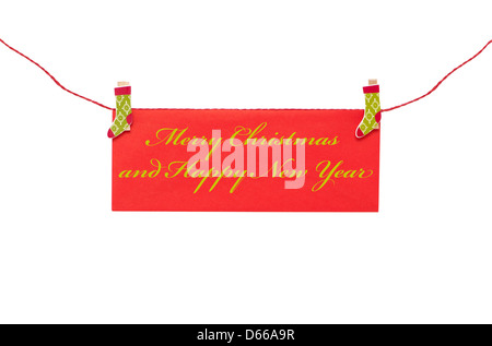 Carte de vœux de Noël avec clothespin suspendus Banque D'Images