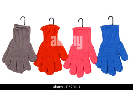 Quatre paires de gants colorés sur fond blanc Banque D'Images