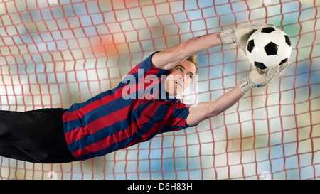 Joueur de foot ball rattrapage dans l'air Banque D'Images