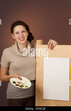 La peinture d'une écolière photo Banque D'Images