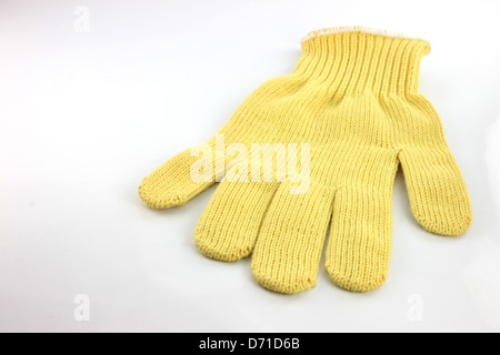 L'accent sur le gants jaune fond blanc. Banque D'Images