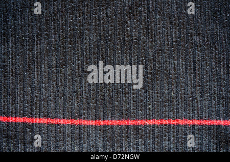 Utilisé avec la texture de laine noire ancienne ligne verticale rouge closeup texture background. Banque D'Images