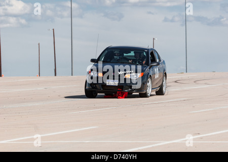 Un Noir 2006 Saturn Ion Redline dans une course automobile autocross régional Sports Car Club of America (SCCA) cas Banque D'Images