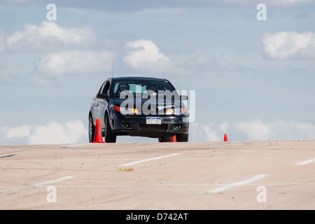 Un Noir 2006 Saturn Ion Redline dans une course automobile autocross régional Sports Car Club of America (SCCA) cas Banque D'Images