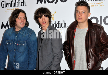 Alex Turner, Matt Helders, Nick O'Malley de Arctic Monkeys Glenfiddich Mojo Honours List 2011 Cérémonie, tenue à la Banque D'Images