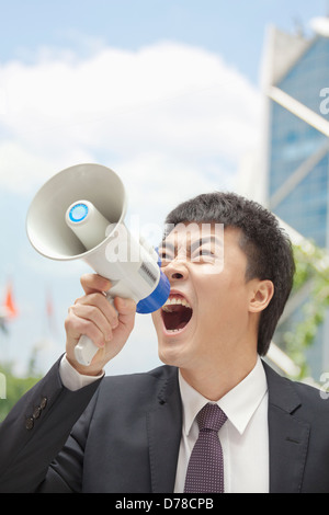 Mid adult businessman with Megaphone Banque D'Images