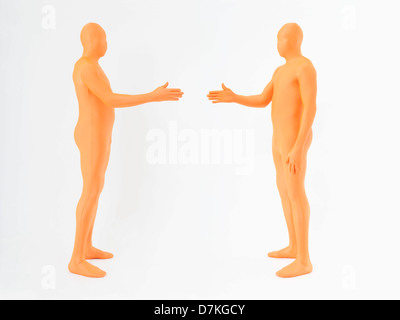 Hommes matures en orange zentai shaking hands on white background Banque D'Images