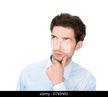 Portrait of a young handsome serious businessman looking up at copyspace. Isolé sur fond blanc Banque D'Images