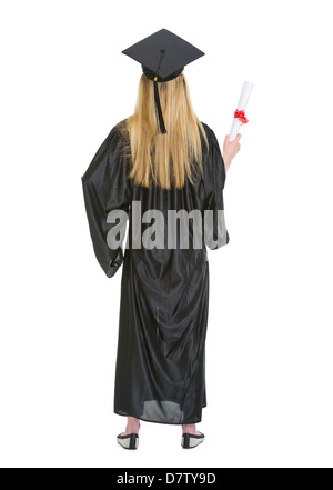 Full Length portrait of woman in graduation gown montrant diploma . vue arrière Banque D'Images