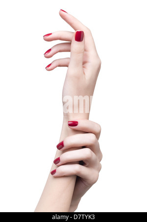 La main de femme rouge professionnel manucure ongles isolated on white Banque D'Images