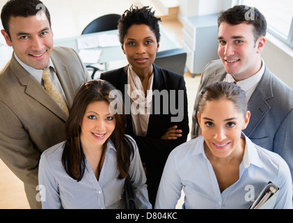 Business people smiling together in office Banque D'Images