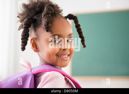 African American girl smiling in classroom Banque D'Images