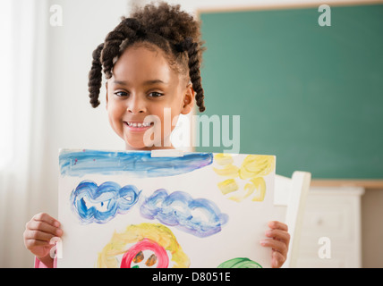 African American Girl with painting in classroom Banque D'Images