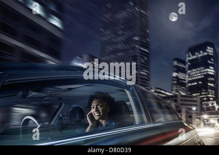 African American Woman driving on cell phone Banque D'Images