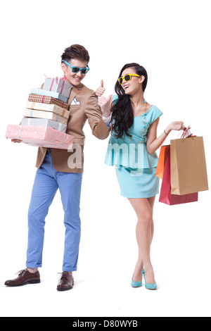 Couple élégant shopping doing Thumbs up Banque D'Images