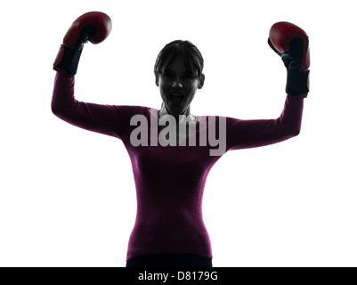 Une femme avec des gants de boxe en silhouette studio isolé sur fond blanc Banque D'Images