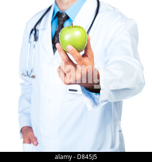 Main du médecin tenant une pomme verte fraîche gros plan sur fond blanc Banque D'Images