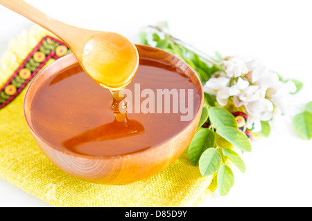 Bol en bois et le miel en acacia Banque D'Images