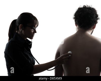 Une femme doctor holding stethoscope silhouette studio isolé sur fond blanc Banque D'Images