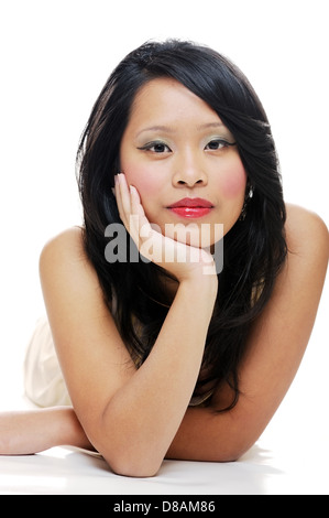 Femme d'origine asiatique à porter du maquillage réfléchie Banque D'Images