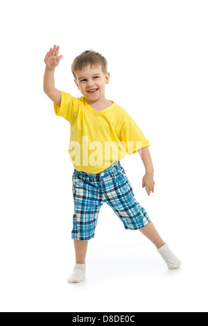 Funny kid boy dancing isolated on white Banque D'Images