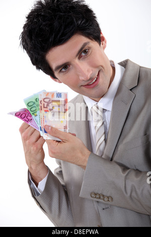 Businessman holding bank notes Banque D'Images