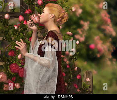 Une dame en costume médiéval sentir une rose Banque D'Images