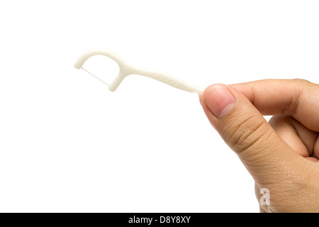 Prise en main un cure-dents flosser dentaire découper sur fond blanc. Banque D'Images