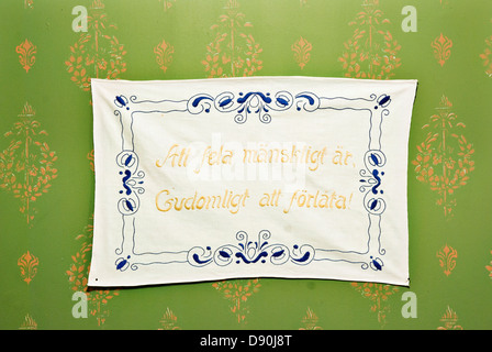 Message brodé sur un wall hanging, Suède. Banque D'Images