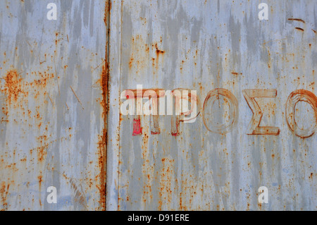 Rusty metal surface avec typographie peinte à la main. Abstract grunge background. Banque D'Images
