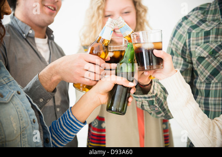 Friends toasting each other at party Banque D'Images