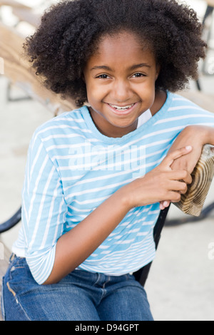 Cape Verdean woman smiling outdoors Banque D'Images