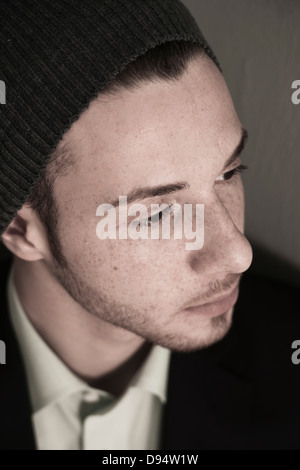 Close-up, High Angle View of Young Man wearing Woolen Hat, Studio Shot Banque D'Images