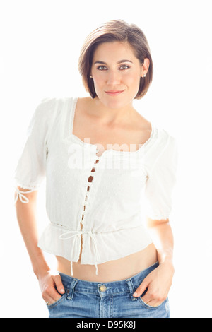 Waist up Portrait of Young Woman in Studio Banque D'Images