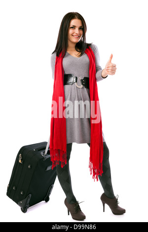 Portrait d'un jeune voyageur avec bagages showing Thumbs up isolé sur fond blanc Banque D'Images