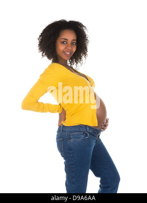 Happy african femme enceinte montrant son ventre Banque D'Images