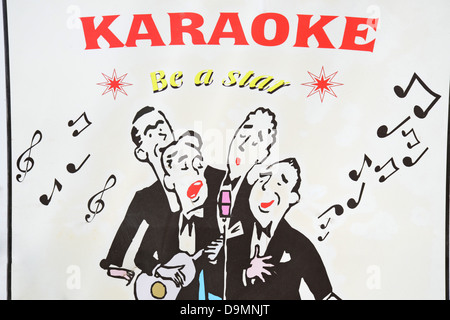Karaoke sign in resort centre-ville, la rue Ermou, Faliraki, Rhodes (Rodos) région, le Dodécanèse, Grèce, région sud de la Mer Egée Banque D'Images