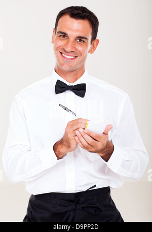 Friendly waiter taking order from customer Banque D'Images