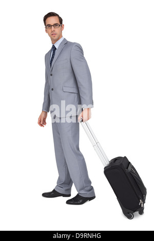 Businessman holding avec des lunettes d'un trolley Banque D'Images