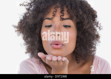 Happy woman blowing a kiss Banque D'Images