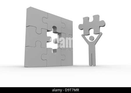 La représentation humaine blanc tenant le morceau de puzzle manquant Banque D'Images