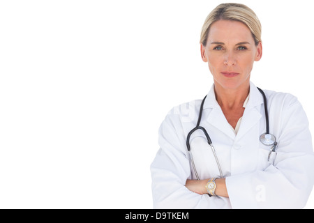 Doctor smiling with her arms crossed Banque D'Images