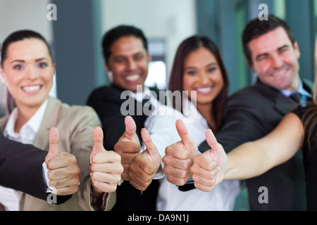 Groupe d'affaires gaie giving Thumbs up Banque D'Images