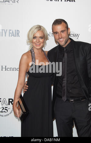 L'actrice Lindsay Lohan et designer allemand Philipp Plein de participer au Gala amfAR 2011 Milano, vente aux enchères et le dîner à la Permanente à Milan, Italie, le 23 septembre, 2011. Photo : Hubert Boesl Banque D'Images