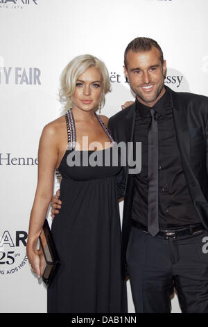 L'actrice Lindsay Lohan et designer allemand Philipp Plein de participer au Gala amfAR 2011 Milano, vente aux enchères et le dîner à la Permanente à Milan, Italie, le 23 septembre, 2011. Photo : Hubert Boesl Banque D'Images